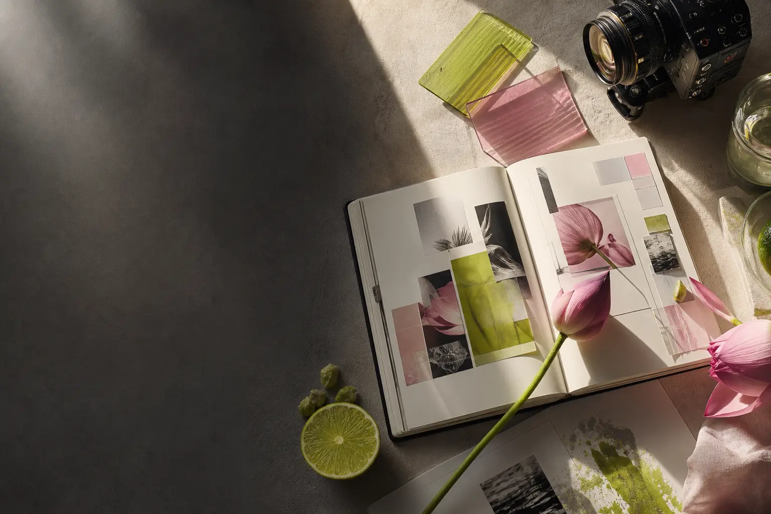 A creative studio table with film, brand, lime, and lotus elements